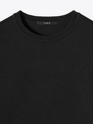 Close-up neck detail of A Brand Collective Kyneton Short Sleeve Knit Tee in black color.