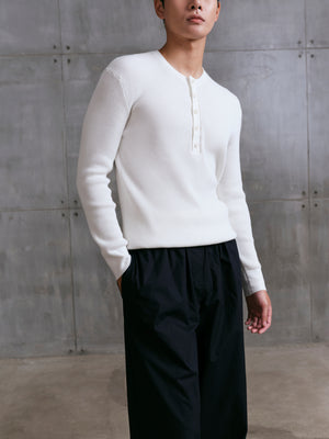Detail shot of the breathable waffle-weave fabric on the AK06 long-sleeve shirt in ivory.