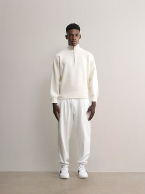 The Glenorchy Double Face Zip Front Knit Polo is made with a double-face knit, featuring a FibreTrace Wool outer layer and a 100% Good Earth Cotton inner layer.