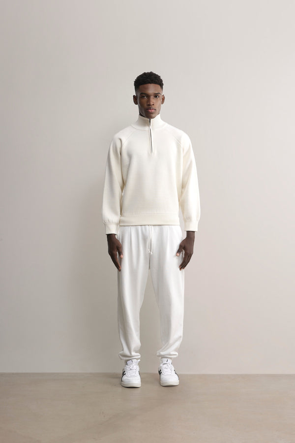 The Glenorchy Double Face Zip Front Knit Polo is made with a double-face knit, featuring a FibreTrace Wool outer layer and a 100% Good Earth Cotton inner layer.