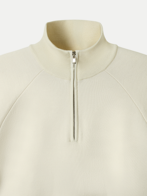 The Glenorchy Double Face Zip Front Knit Polo features a double-face construction, with an outer layer crafted from FibreTrace Wool and an inner layer made from 100% Good Earth Cotton.