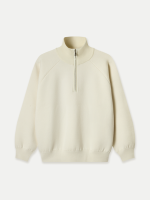 The Glenorchy Double Face Zip Front Knit Polo features a double-face construction, with an outer layer crafted from FibreTrace Wool and an inner layer made from 100% Good Earth Cotton.