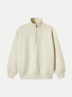 The Glenorchy Double Face Zip Front Knit Polo features a double-face construction, with an outer layer crafted from FibreTrace Wool and an inner layer made from 100% Good Earth Cotton.