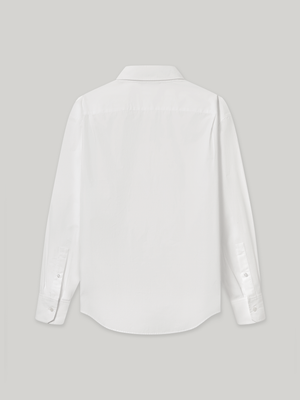 Moree Ruffle Dress Shirt is a white long-sleeve dress shirt with a ruffle front panel running down the centre — a formal detail reinterpreted for everyday wear. Features a classic point collar, a hidden button placket beneath the ruffle, and buttoned cuffs. 