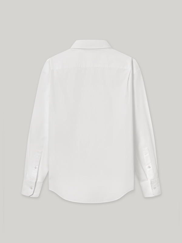 Moree Ruffle Dress Shirt is a white long-sleeve dress shirt with a ruffle front panel running down the centre — a formal detail reinterpreted for everyday wear. Features a classic point collar, a hidden button placket beneath the ruffle, and buttoned cuffs. 