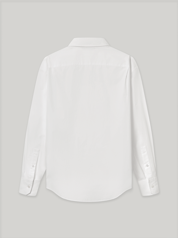 Moree Ruffle Dress Shirt is a white long-sleeve dress shirt with a ruffle front panel running down the centre — a formal detail reinterpreted for everyday wear. Features a classic point collar, a hidden button placket beneath the ruffle, and buttoned cuffs. 
