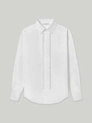 Moree Ruffle Dress Shirt is a white long-sleeve dress shirt with a ruffle front panel running down the centre — a formal detail reinterpreted for everyday wear. Features a classic point collar, a hidden button placket beneath the ruffle, and buttoned cuffs. 