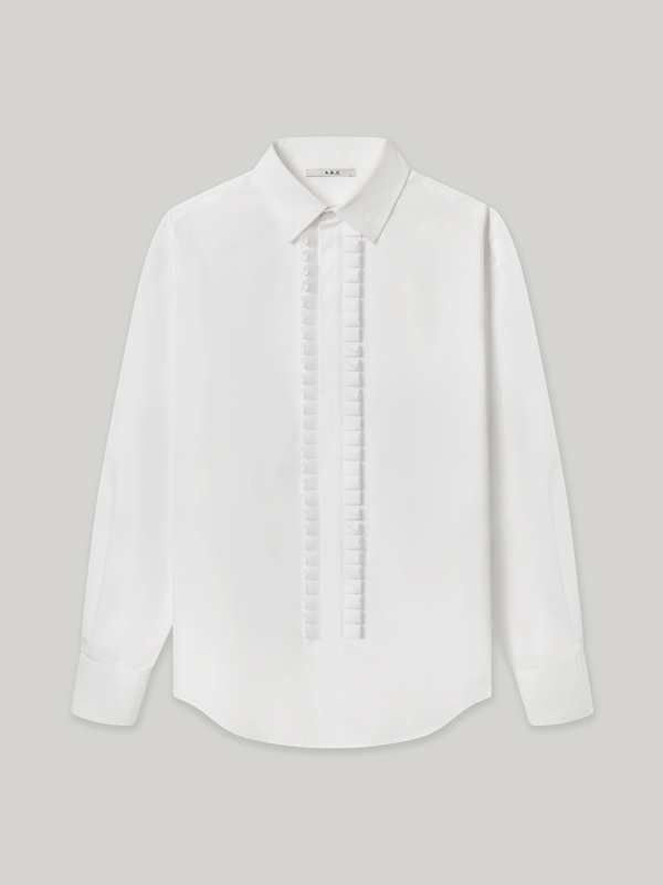 Moree Ruffle Dress Shirt is a white long-sleeve dress shirt with a ruffle front panel running down the centre — a formal detail reinterpreted for everyday wear. Features a classic point collar, a hidden button placket beneath the ruffle, and buttoned cuffs. 