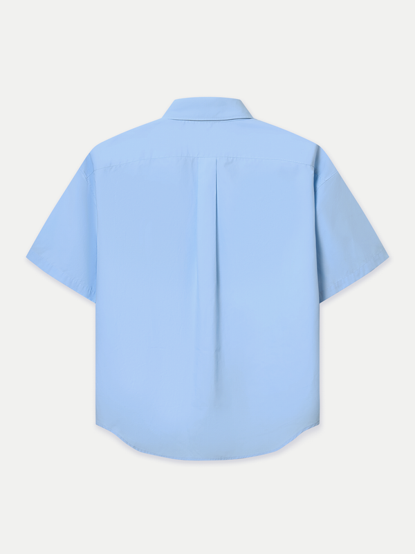 Designed for a relaxed fit, it features a classic point collar, a neat front button placket and double flap chest pockets. Wear it tucked in for a polished finish or left out for an effortlessly casual look.