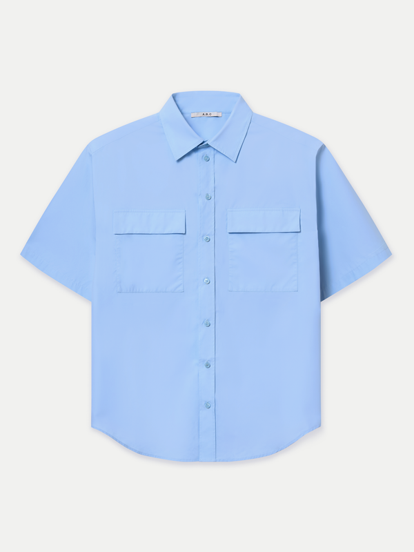Designed for a relaxed fit, it features a classic point collar, a neat front button placket and double flap chest pockets. Wear it tucked in for a polished finish or left out for an effortlessly casual look.