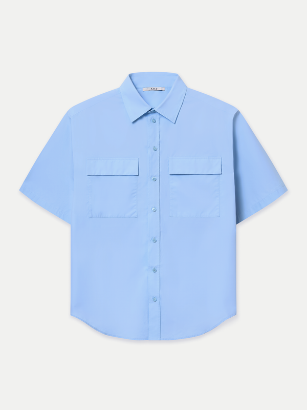 Designed for a relaxed fit, it features a classic point collar, a neat front button placket and double flap chest pockets. Wear it tucked in for a polished finish or left out for an effortlessly casual look.