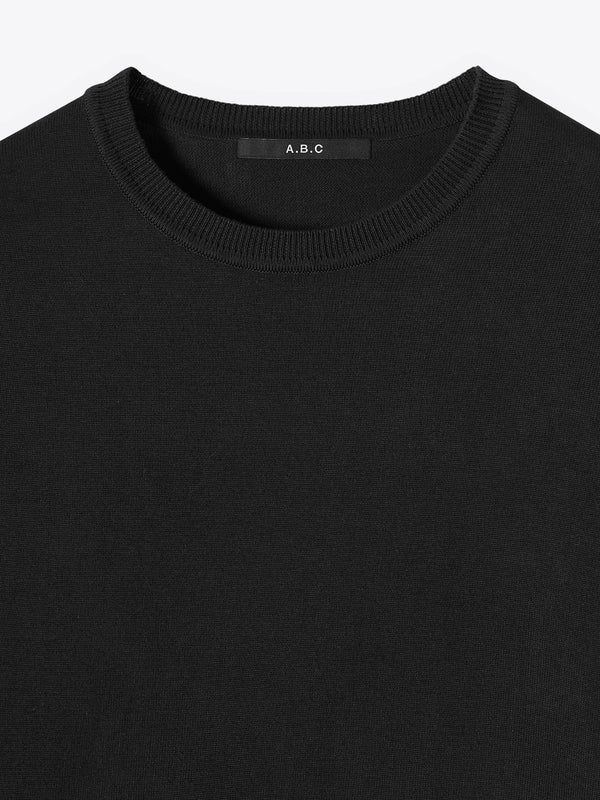 Close-up neck detail of A Brand Collective Kyneton Short Sleeve Knit Tee in black color.