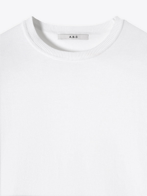 Close-up neck detail of A Brand Collective Kyneton Short Sleeve Knit Tee in White color.