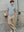 Model styling the grey marle Kyneton knit polo with tan trousers A.B.C A BRAND COLLECTIVE climate positive cotton