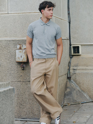 Model styling the grey marle Kyneton knit polo with tan trousers A.B.C A BRAND COLLECTIVE climate positive cotton
