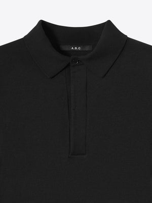 Close up of the refined collar on the black Kyneton Relaxed Fit Knit Polo A.B.C A BRAND COLLECTIVE durable knit texture