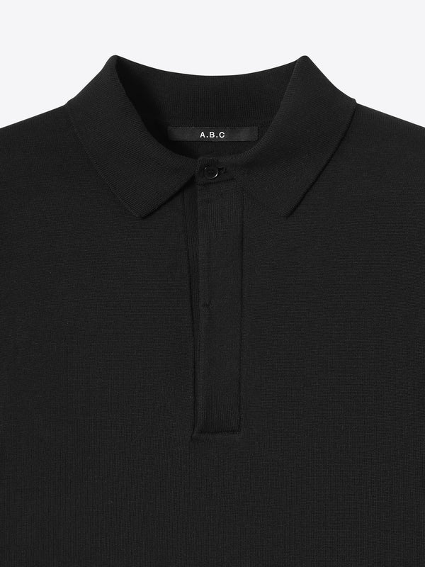 Close up of the refined collar on the black Kyneton Relaxed Fit Knit Polo A.B.C A BRAND COLLECTIVE durable knit texture