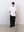 Lifestyle view of the white Kyneton Relaxed Fit Knit Polo A.B.C A BRAND COLLECTIVE premium sustainable cotton