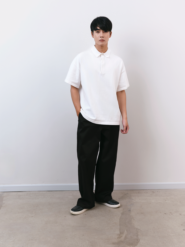 Lifestyle view of the white Kyneton Relaxed Fit Knit Polo A.B.C A BRAND COLLECTIVE premium sustainable cotton
