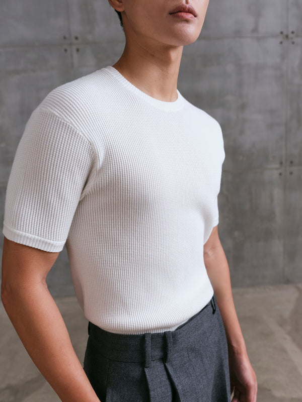 Close-up of the textured airflow design on the white Windsor Waffle Knit Tee A.B.C A BRAND COLLECTIVE.