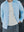 Detailed texture of the white Windsor Waffle Knit Tee A.B.C A BRAND COLLECTIVE under a light blue shirt.