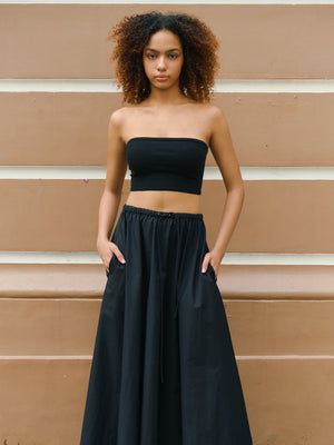 Confident model styling the black Preston bandeau with a flowy skirt for a modern A.B.C A BRAND COLLECTIVE look.
