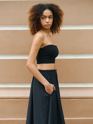 Side profile showing the secure fit and comfortable cropped cut of this black 100% Good Earth Cotton top.
