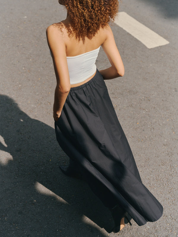 High angle view of the white Preston Midi top highlighting the breathable and soft Good Earth Cotton texture.