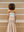 Back view of the white regular bandeau by A.B.C A BRAND COLLECTIVE, ideal for versatile layering.