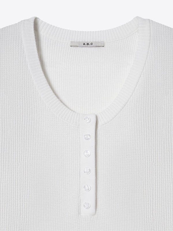 A.B.C A BRAND COLLECTIVE Windsor Scooped Top close up of 6 delicate buttons on soft ivory waffle knit fabric Signature Cotton Blend