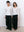 A.B.C A BRAND COLLECTIVE Windsor Scooped Top couple in ivory tops showing comfortable unisex styling with black trousers Signature Cotton Blend