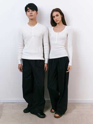 A.B.C A BRAND COLLECTIVE Windsor Scooped Top couple in ivory tops showing comfortable unisex styling with black trousers Signature Cotton Blend