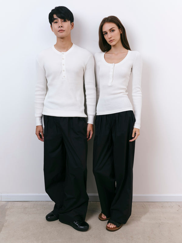A.B.C A BRAND COLLECTIVE Windsor Scooped Top couple in ivory tops showing comfortable unisex styling with black trousers Signature Cotton Blend