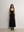 Model styling the black A.B.C A BRAND COLLECTIVE Fawkner maxi dress for an effortlessly elegant look.