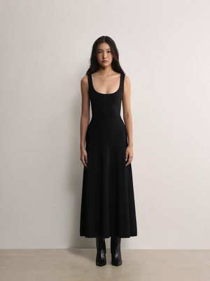 Model styling the black A.B.C A BRAND COLLECTIVE Fawkner maxi dress for an effortlessly elegant look.