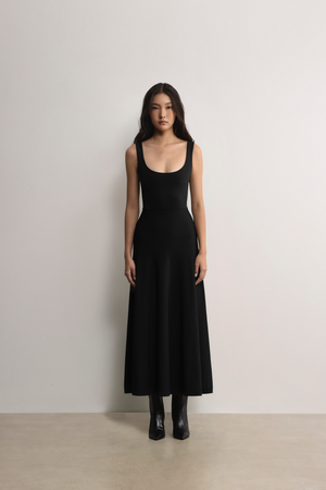 Model styling the black A.B.C A BRAND COLLECTIVE Fawkner maxi dress for an effortlessly elegant look.