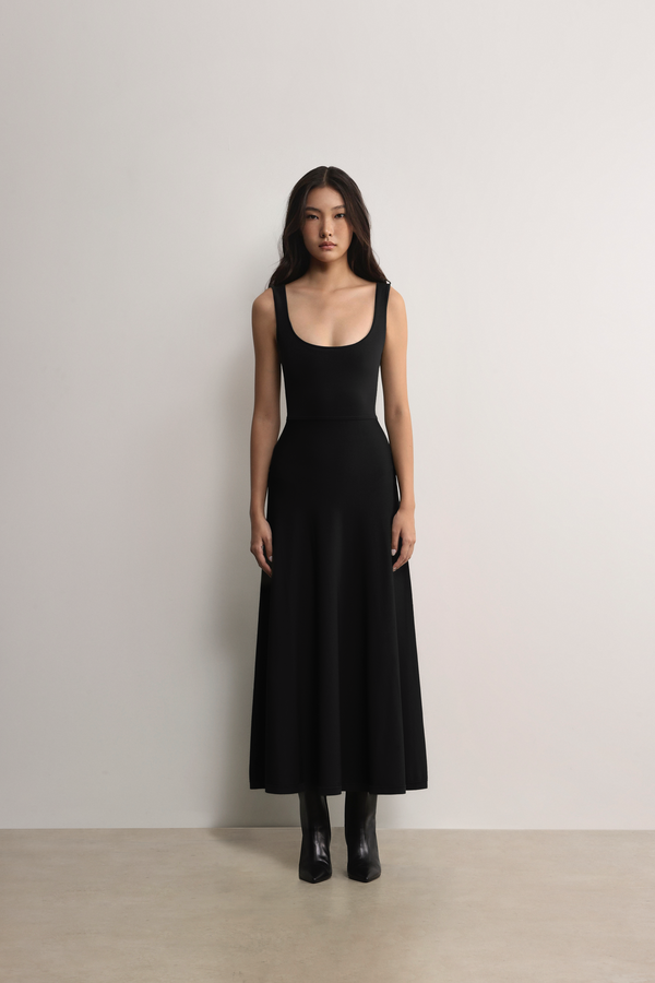 Model styling the black A.B.C A BRAND COLLECTIVE Fawkner maxi dress for an effortlessly elegant look.
