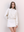 A.B.C A BRAND COLLECTIVE Kyneton Hoodie female model wearing ivory cropped top with a mini skirt for a chic tonal look 100% Cotton