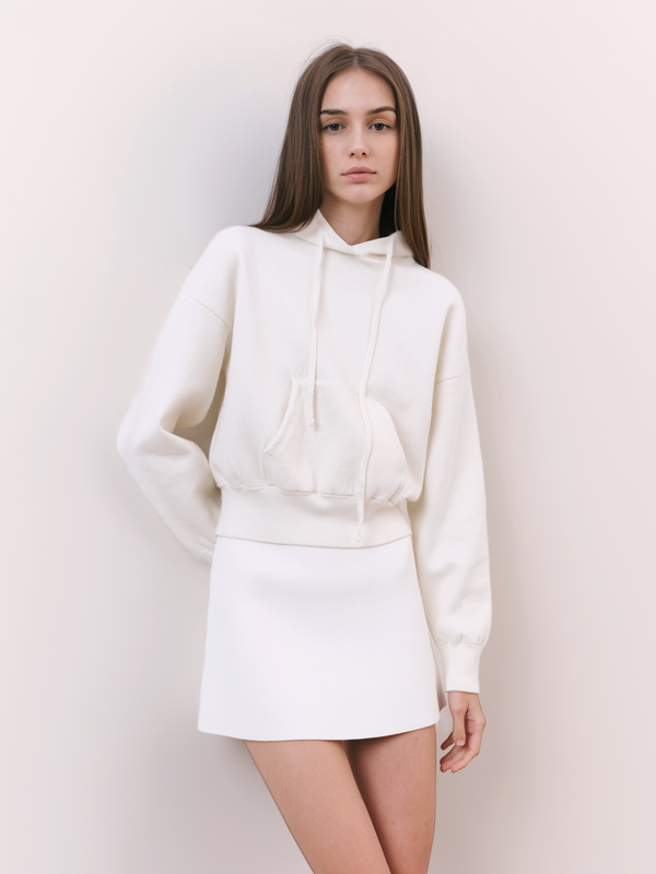 A.B.C A BRAND COLLECTIVE Kyneton Hoodie female model wearing ivory cropped top with a mini skirt for a chic tonal look 100% Cotton