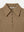 Detailed view of the wide rib texture and collar on the tan A.B.C A BRAND COLLECTIVE Newport top.