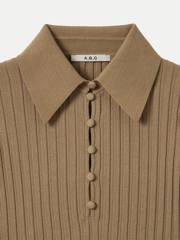 Detailed view of the wide rib texture and collar on the tan A.B.C A BRAND COLLECTIVE Newport top.
