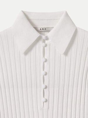 Detailed look at the breathable white wide rib knit fabric of the A.B.C A BRAND COLLECTIVE Newport top.