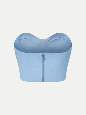 Rear view of the blue A.B.C A BRAND COLLECTIVE bustier showing the functional metallic zipper closure.