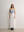 Model styling the sky blue A.B.C A BRAND COLLECTIVE bustier with a white maxi skirt for a fresh aesthetic
