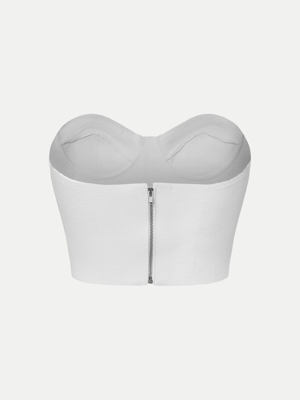 Rear view of the white A.B.C A BRAND COLLECTIVE bustier showcasing the clean, structured silhouette.