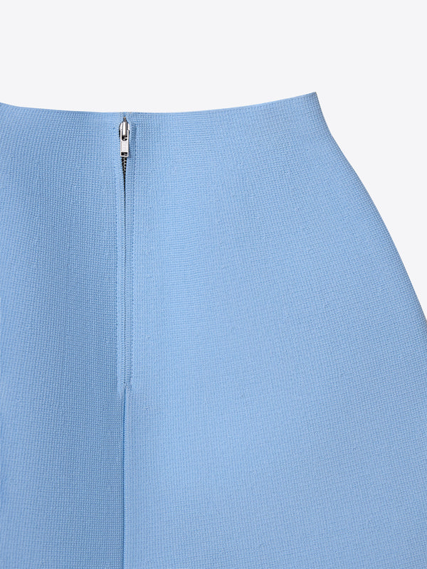 Detailed view of the structured waist and zipper on the blue A.B.C A BRAND COLLECTIVE skirt.