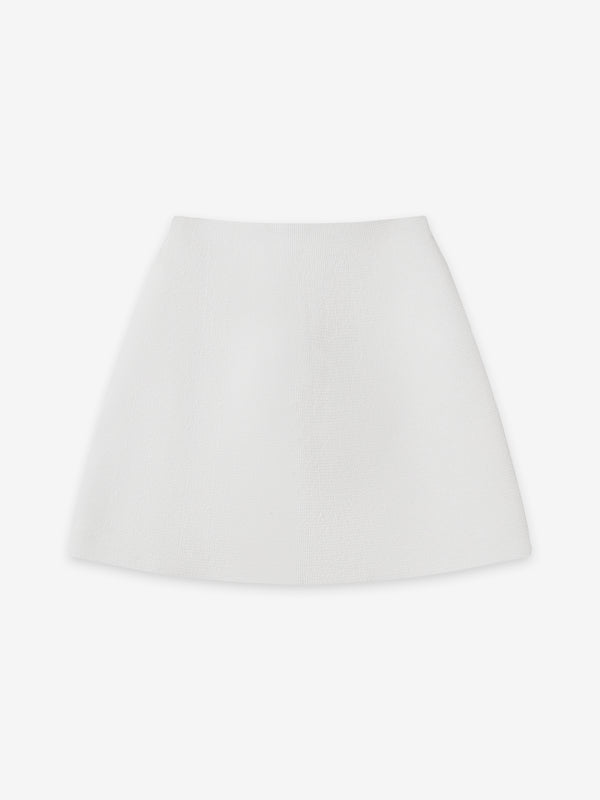Ivory Fawkner Milano Knit Mini Skirt by A.B.C A BRAND COLLECTIVE for professional or casual wear.