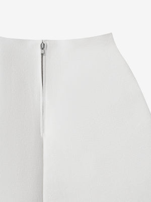 Close-up of the clean finish and zipper on the ivory A.B.C A BRAND COLLECTIVE knit skirt.