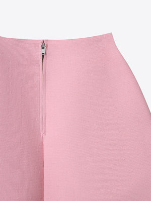 Detailed view of the back zip closure on the pink A.B.C A BRAND COLLECTIVE Milano knit skirt.