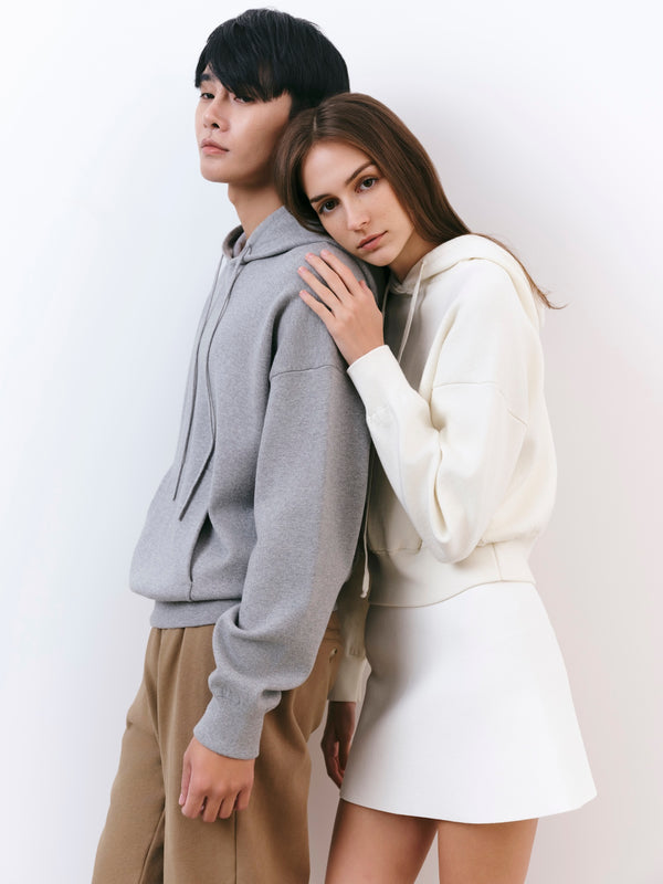 A.B.C A BRAND COLLECTIVE Kyneton Hoodie models leaning together to showcase the soft drape and cozy knit feel 100% Good Earth Cotton